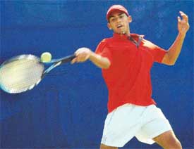 Narinder of Chandigarh in action on the opening day of qualifying rounds of ITF Tennis