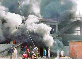Smoke billows from a warehouse where a fire broke out in Industrial Area, Phase VIII, Mohali