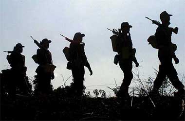 Policemen march along the outskirts of Jammu 