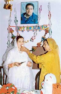 A file photo of Ajmer Kaur offering a piece of cake to Ikwinder Kaur on the birthday celebrations of her son Rajinder Singh Kuler