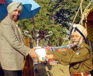 The Commandant of the 89th Battalion of the CRPF, Mr S.S. Sandhu (right), receives the Best Operational Battalion Trophy from the Additional Director-General, Mr Kanwal Jeet Singh
