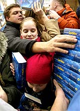 Russians scramble for copies of Harry Potter and the Order of the Phoenix at a Moscow book store on Friday night