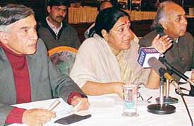Ms Prabha Thakur (centre), spokesperson of the AICC, talks to mediapersons at a press conference in Chandigarh on Sunday. 