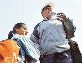 Former tennis player Ramesh Krishnan with his daughter, Gayatri, at the ITF Junior Circuit Tennis Tournament being held at the CLTA, Chandigarh, on Sunday.