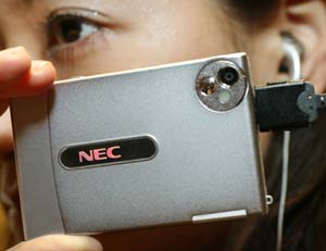 NEC Corp unveils a camera equipped with a mobile phone in Tokyo