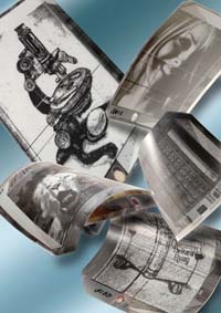 Dutch firm Philips Electronics said it was preparing to mass-produce a slim, book-sized display panel onto which consumers could download newspapers and magazines  then roll up and put away. 