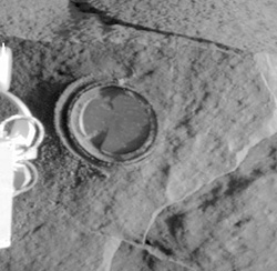 This image, released on Saturday, shows a round, shallow depression resulting from historys first grinding of a rock on Mars