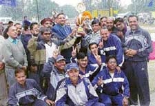 The players of the Haryana zone who won basketball and volleyball titles in the North Zone Employees Provident Fund Tournament in Ludhiana on Monday. 