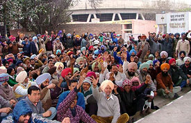 Members of the GNDTP Employees Federation hold a rally in front of the thermal plant in Bathinda