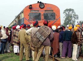 A group of farmers demonstrate by blocking railway track near Amritsar