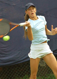 Yanina Wickmayer of Belgium hits a forehand return to Madura Rangnathan of India 