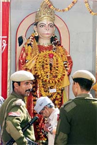 Security personnel stand guard near a newly installed idol of Lord Hanuman at Raghunath Temple in Jammu