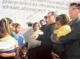 Mr Harnam Dass Johar, Minister Higher Education, Punjab, enquires about the health of a diarrhoea patient, a resident of Hargobind Nagar