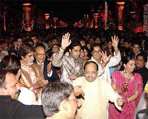Bollywood superstar Amitabh Bachchan, his son Abishek Bachchan, Lord Swraj Paul of the UK and Samajwadi Party General Secretary Amar Singh dance at the marriage ceremony of Sushanto Roy