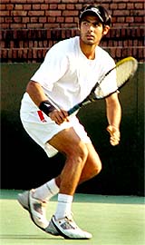 Navdeep Singh in action during his doubles match at the ITF Juniors tennis tournament