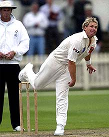 Australian spinner Shane Warne bowls during a first class match between Victorias 2nd XI and Queensland Academy 