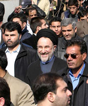 Iranian President Mohammad Khatami walks with the people during a demonstration at Teherans Azadi Square on Wednesday. Khatami warned his hardline opponents that they were turning young Iranians against religion and the Islamic Republic founded by Ayatollah Ruhollah Khomeini exactly 25 years ago. 
