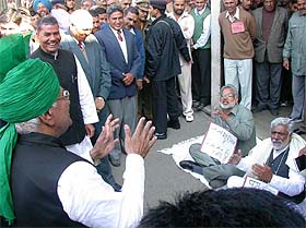 Haryana Chief Minister Om Prakash Chautala cracks jokes at two suspended Congress MLAs, Mr Jai Parkash and Dr Raghbir Singh Kadiyan, sitting on a dharna in front of the Haryana Vidhan Sabha