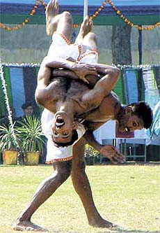 Jawans displaying taekwondo on the occasion of 93rd Anniversary of Corps of Signals at Army HQ in the Capital