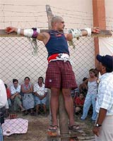 A Bolivian inmate is seen after being crucified during a protest by inmates