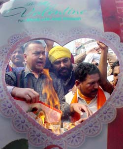 Activists of the Shiv Sena burn Valentines Day cards in Ludhiana