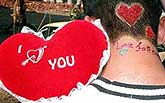 A young boy decorates his head to celebrate Valentine's Day