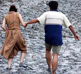 A couple enjoying in the mud on the banks of the Hoogly river