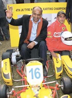 Union Minister of State Vijay Goel with a participant at the 4th Go Karting National Championship final in the Capital on Friday.