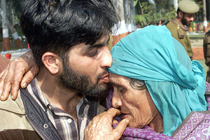 Liyaqat Ali, a suspected Kashmiri separatist, kisses his mother after he laid down his arms