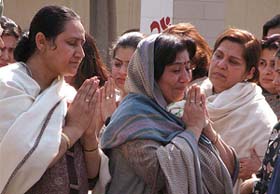 The grieving family members of Ashwani K. Puri