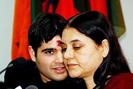 Former Union Minister Maneka Gandhi listens to her son Varun Gandhi at the BJP headquarters in New Delhi