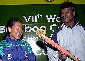 Hockey star Dhanraj Pillay and women's hockey captain Suraj Lata Devi share a discussion during a Press conference in New Delhi 