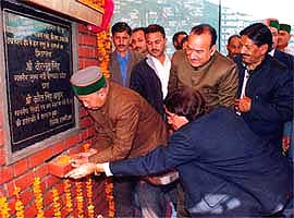 Himachal Pradesh Chief Minster Virbhadra Singh lays the foundation stone of a water supply scheme at Tihra in Mandi district 