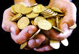 A handful of Australian one-dollar coins