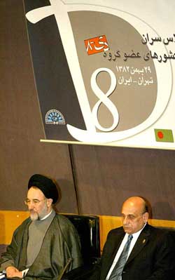Iranian President Mohammad Khatami and Egyptian Foreign Minister Ahmed Maher listen to speeches at the D-8 summit