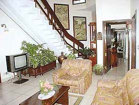 Natures bounty is expressed through indoor plants and wall panels depicting animal forms