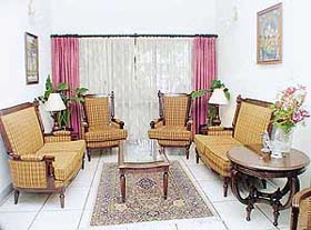 The drawing room is done up in American style