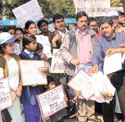 Activists of NAFRE burning copies of Education Bill 2004 for the Shiksha Samaanta Yatra during the march for Common School System in the Capital
