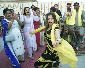 Pakistani women dance to celebrate Basant, a traditional spring festival, in the central city of Multan on Friday.