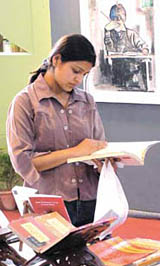 A picture of concentration: A young bibliophile during the 16th World Book Fair at Pragati Maidan in the Capital on Saturday.