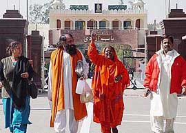 Members of the Hindu jatha return from Pakistan after paying obeisance at temples there on Sunday