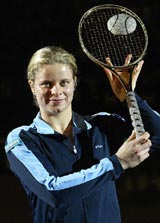 Belgium's Kim Klijsters holds the Diamond Racket trophy after defeating Italy's Silvia Farina Elia in the final of the WTA Proximus Diamond Games tournament 