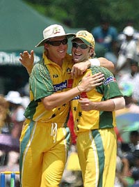 Australia's Michael Clarke and Brett Lee celebrate the dismissal of Sri Lankan batsman Russel Arnold 