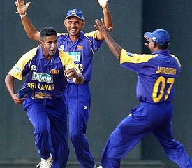Sri Lanka's Chaminda Vass, captain Marvan Atapattu and Sanath Jayasuriya celebrate their victory over Australia 