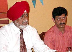 Mr P.S. Chhabra, secretary-general, and Mr Prem Puri, vice-president, of the SGFI at a press conference in Chandigarh