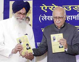 Deputy Prime Minister L. K. Advani releases the book 'Aise Udda Pinjare Ka Panchhi', written by Andhra Pradesh Governor Surjeet Singh Barnala, at his residence in New Delhi on Monday