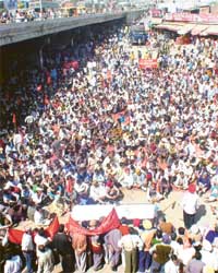 Workers hold a protest rally near the Ludhiana bus stand in Ludhiana 