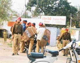 The police camping outside the Sherpur police post to protect it against a mob of labourers