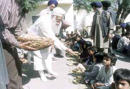 Delhi Sikh Gurdwara Management Committee president Prahlad Singh Chandok distributing langar in the Capital.