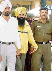 Gurvinder Singh, alias Goldy, who gave money to Hawara, being produced in a Chandigarh court 